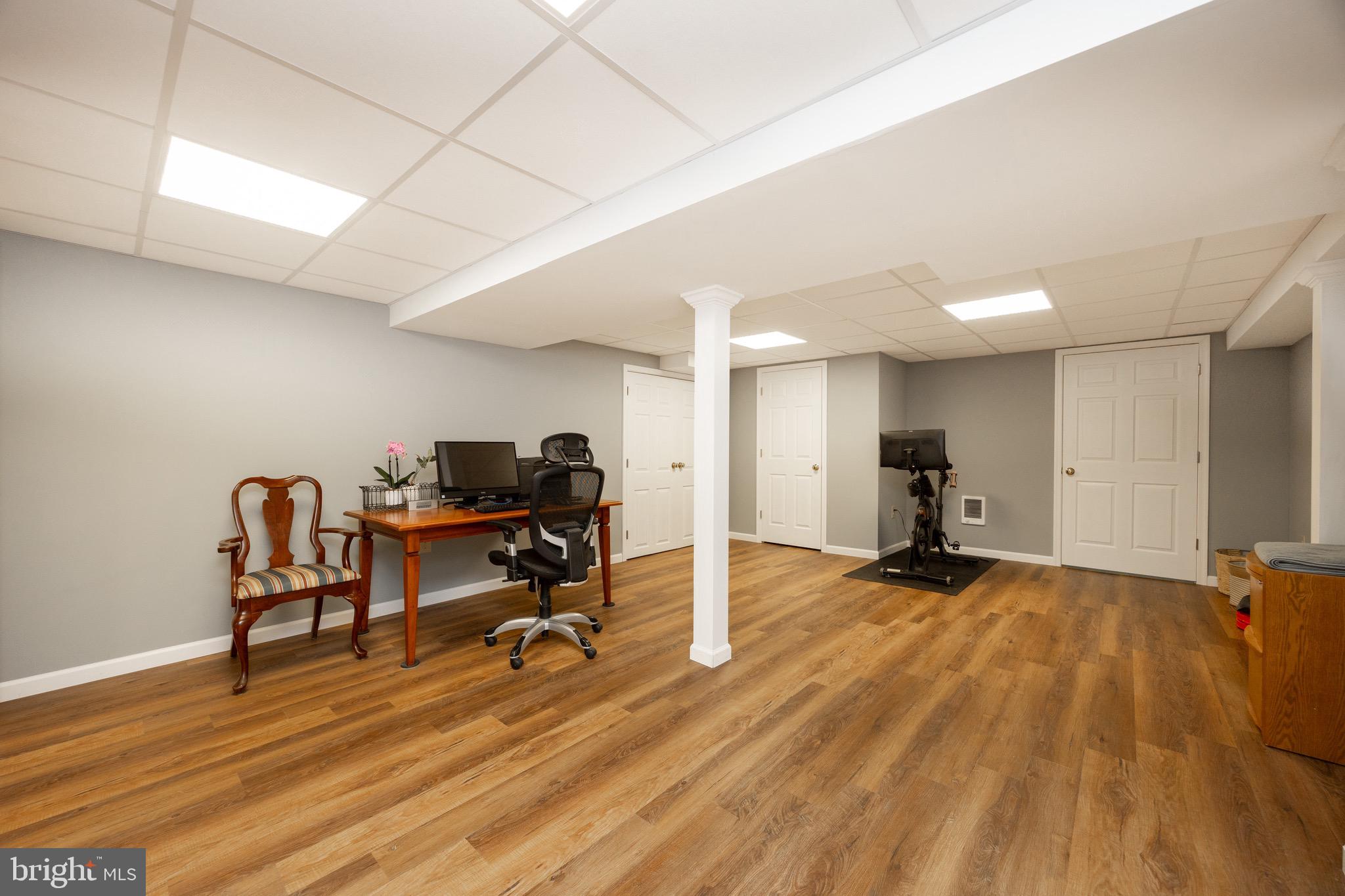 2220 Bodine Road Malvern, PA 19355 - Photo 64 of 86 a view of a workspace with furniture and a wooden floor