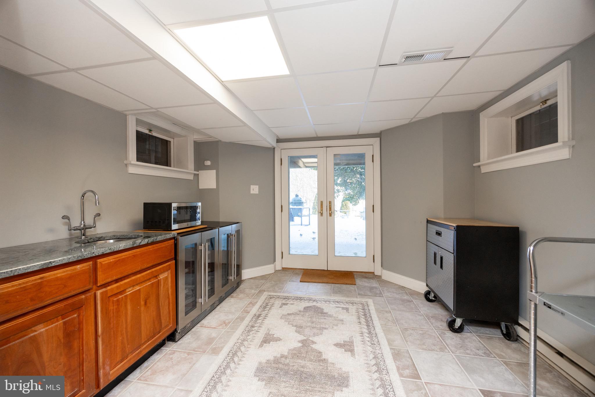 2220 Bodine Road Malvern, PA 19355 - Photo 67 of 86 a large kitchen with stainless steel appliances granite countertop a stove a sink dishwasher a microwave oven with granite countertops and cabinets