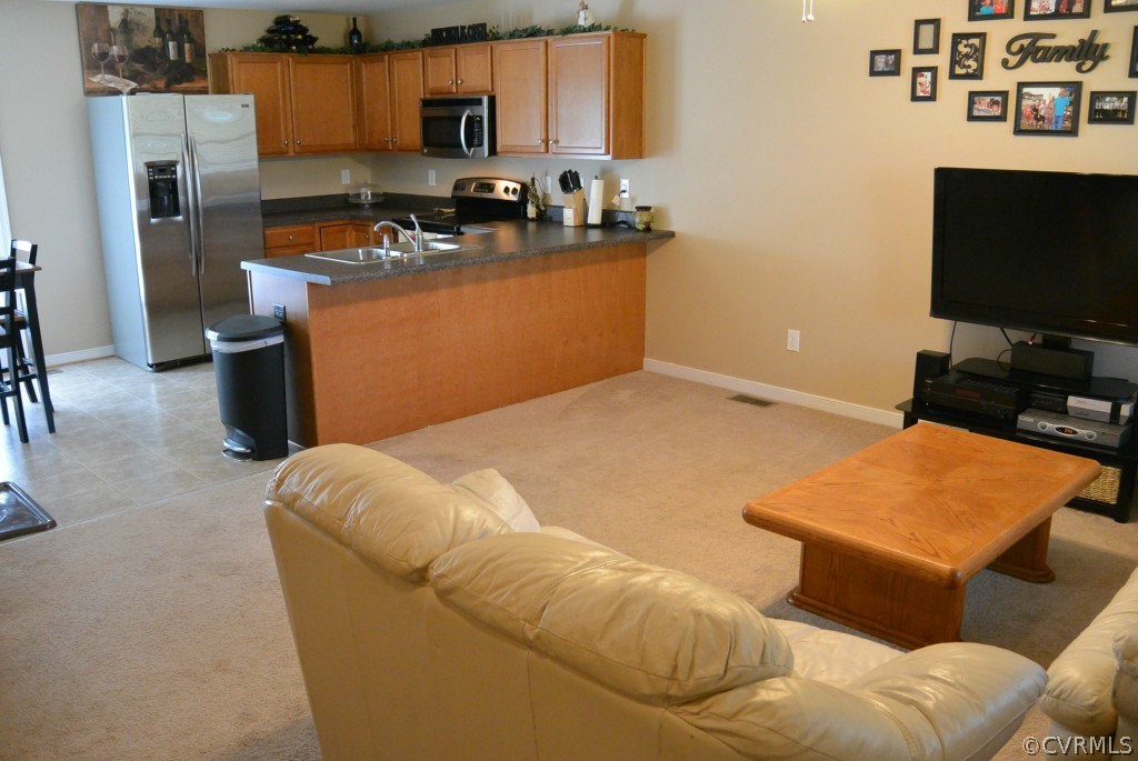 3141 Quaker Road Quinton, VA 23141 - Photo 3 of 12 a room with furniture and a flat screen tv