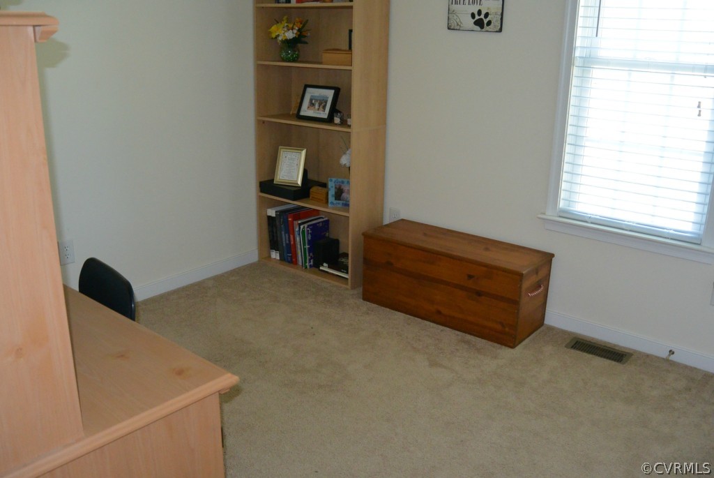3141 Quaker Road Quinton, VA 23141 - Photo 7 of 12 a living room with furniture and a book shelf