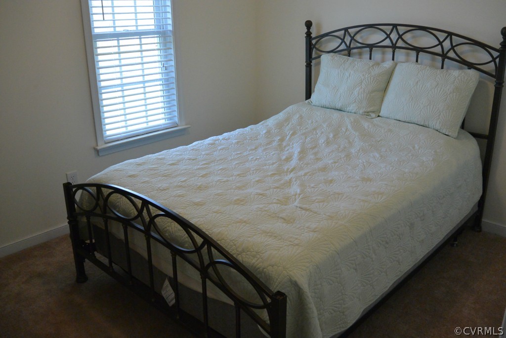 3141 Quaker Road Quinton, VA 23141 - Photo 8 of 12 a bedroom with a bed and a window