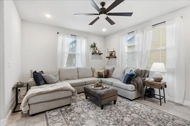 a living room with furniture and a large window