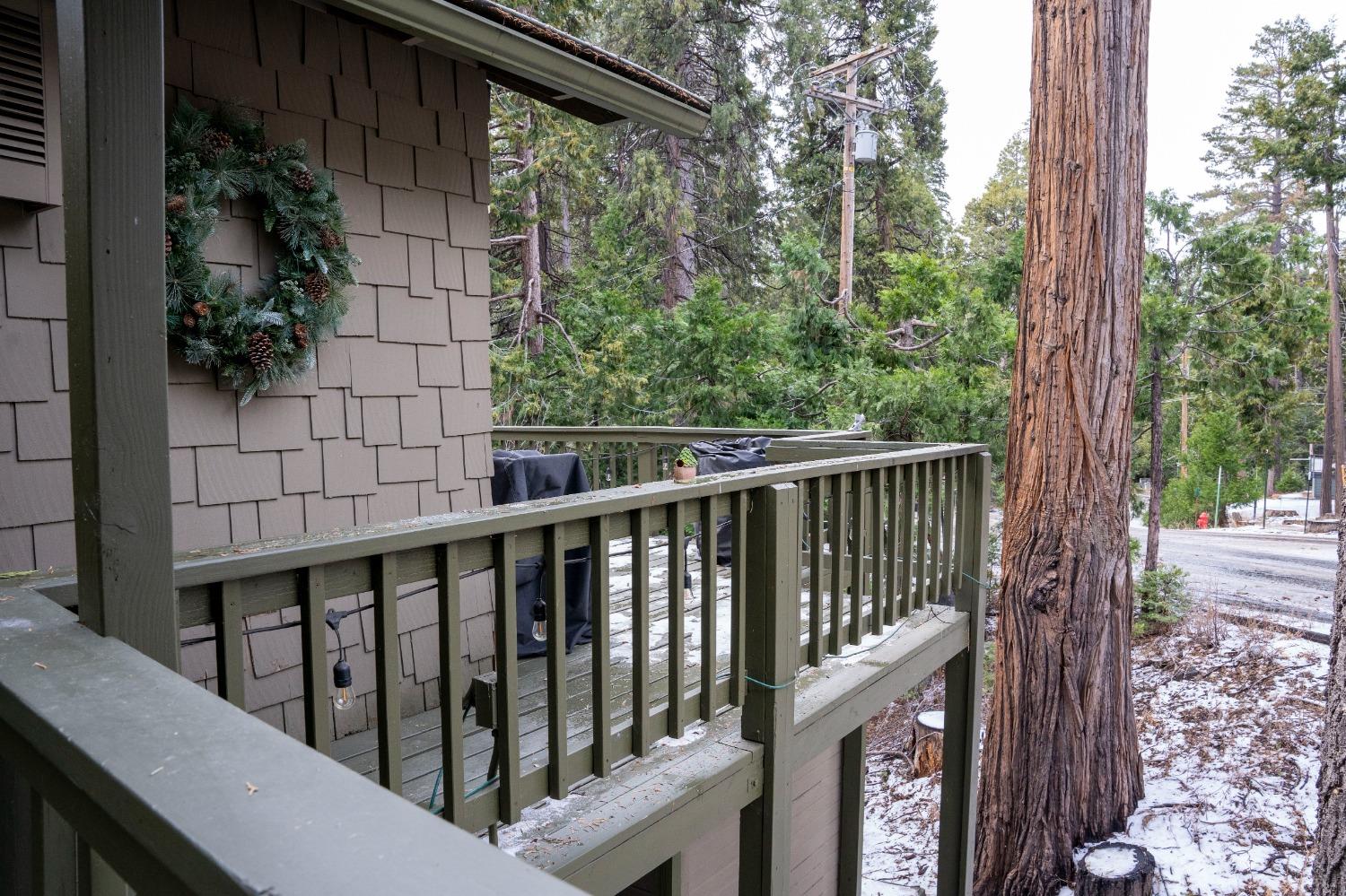 42135 Hanging Branch Road Shaver Lake, CA 93664 - Photo 15 of 55 a view of a balcony with trees