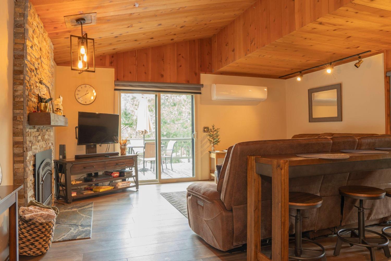 42135 Hanging Branch Road Shaver Lake, CA 93664 - Photo 23 of 55 a living room with furniture and a flat screen tv