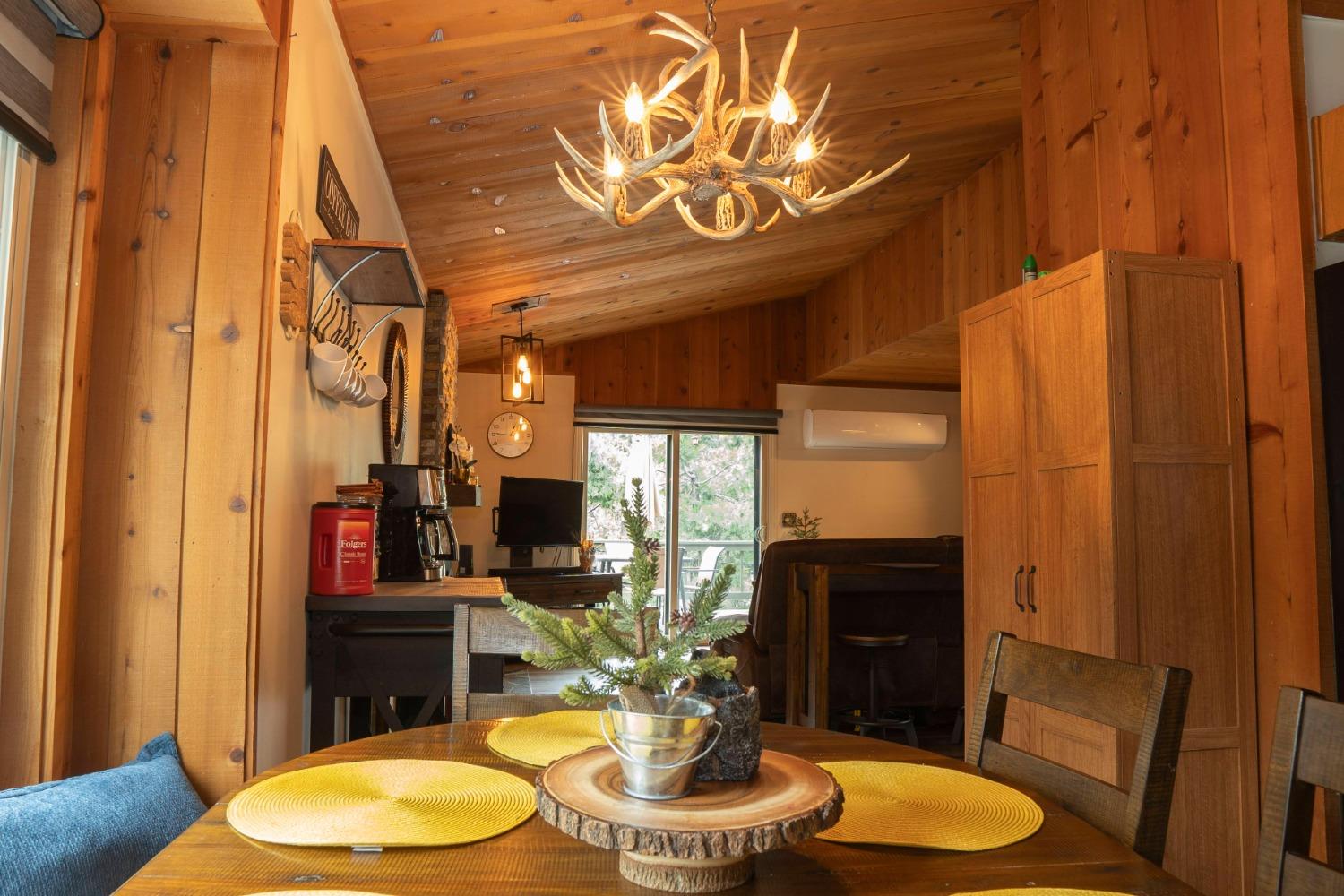42135 Hanging Branch Road Shaver Lake, CA 93664 - Photo 36 of 55 a bathroom with a granite countertop sink and a mirror