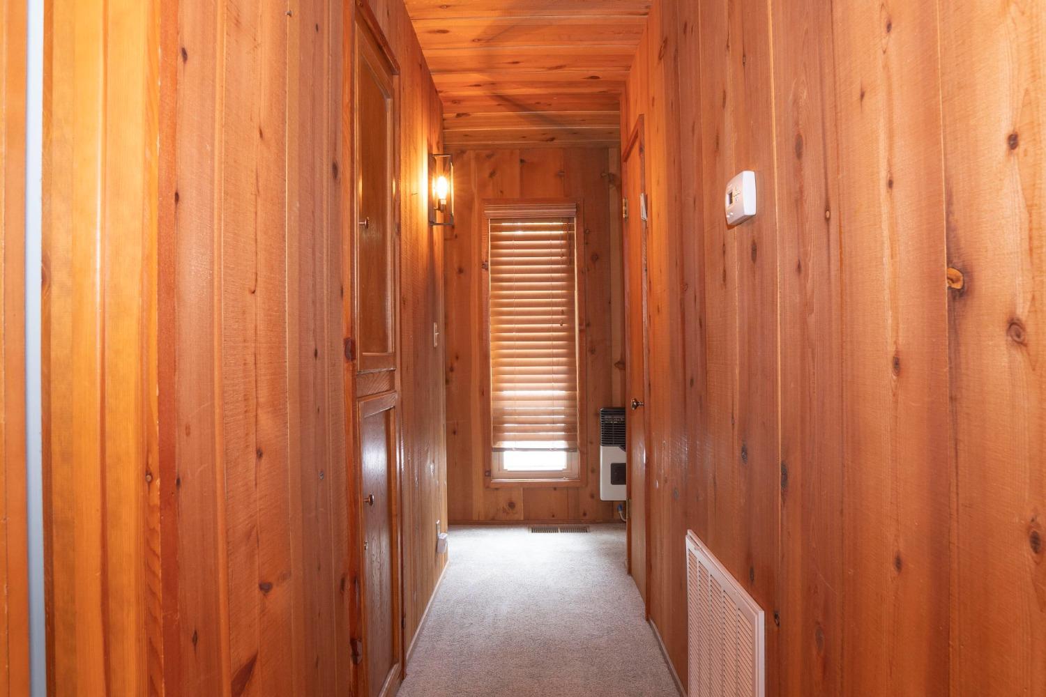 42135 Hanging Branch Road Shaver Lake, CA 93664 - Photo 49 of 55 a view of a elevator with wooden walls