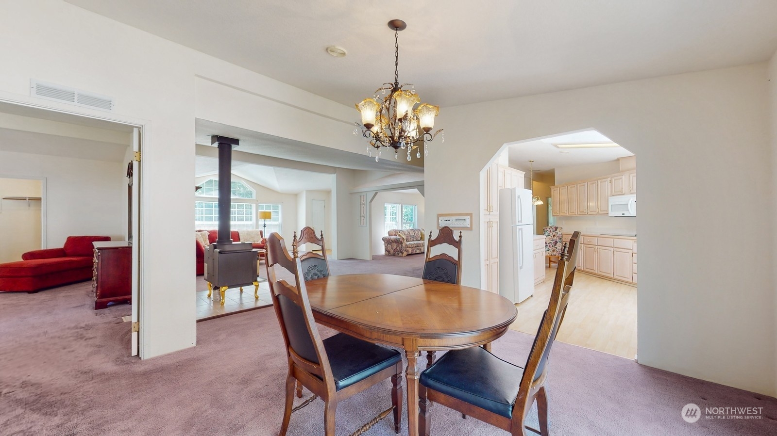 5507 189th Street Southeast Bothell, WA 98012 - Photo 11 of 37 a view of a dining room with furniture and a chandelier