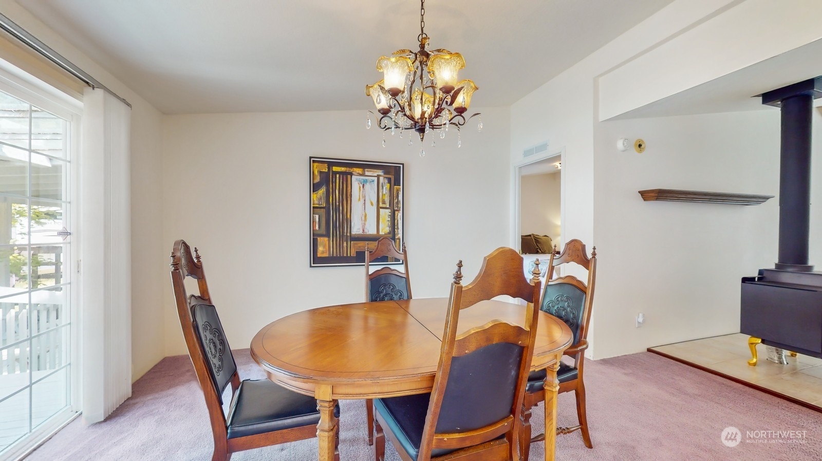 5507 189th Street Southeast Bothell, WA 98012 - Photo 12 of 37 a view of a dining room with furniture and chandelier