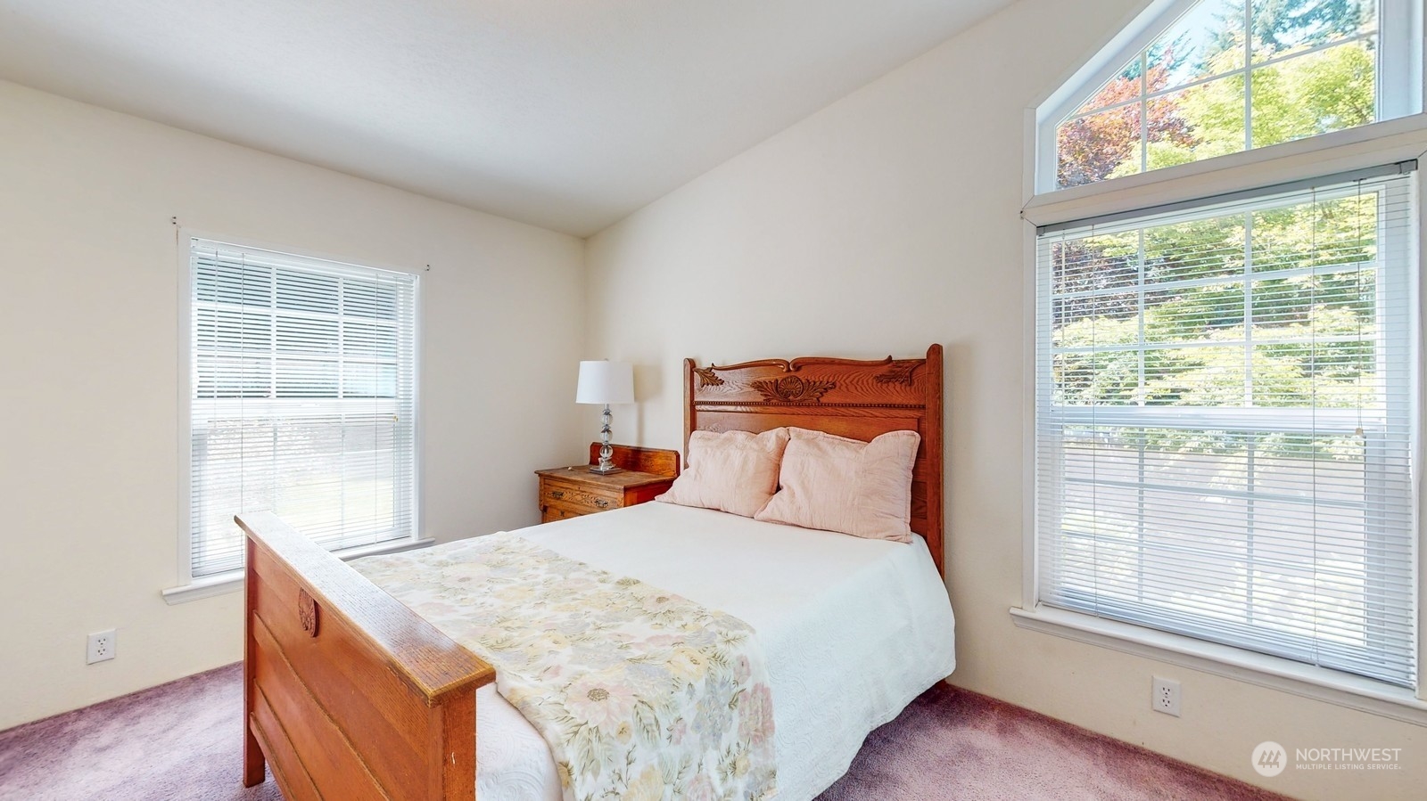5507 189th Street Southeast Bothell, WA 98012 - Photo 19 of 37 a bedroom with a large bed and a window