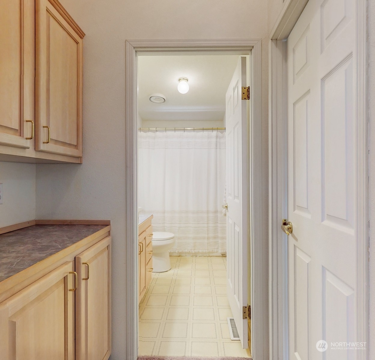 5507 189th Street Southeast Bothell, WA 98012 - Photo 21 of 37 a bathroom with a granite countertop sink and a mirror