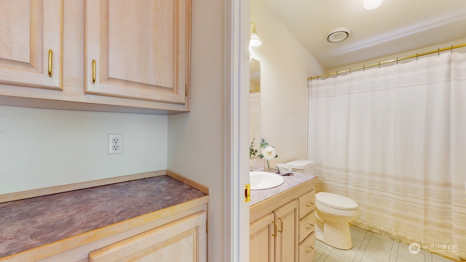 5507 189th Street Southeast Bothell, WA 98012 - Photo 22 of 37 a bathroom with a granite countertop sink and a mirror