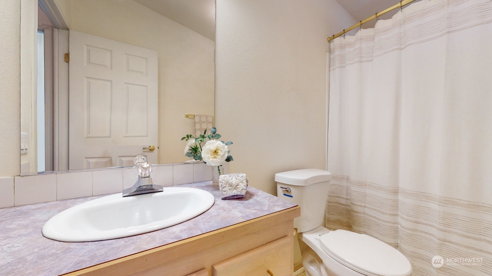 5507 189th Street Southeast Bothell, WA 98012 - Photo 23 of 37 a bathroom with a granite countertop sink a toilet and a mirror