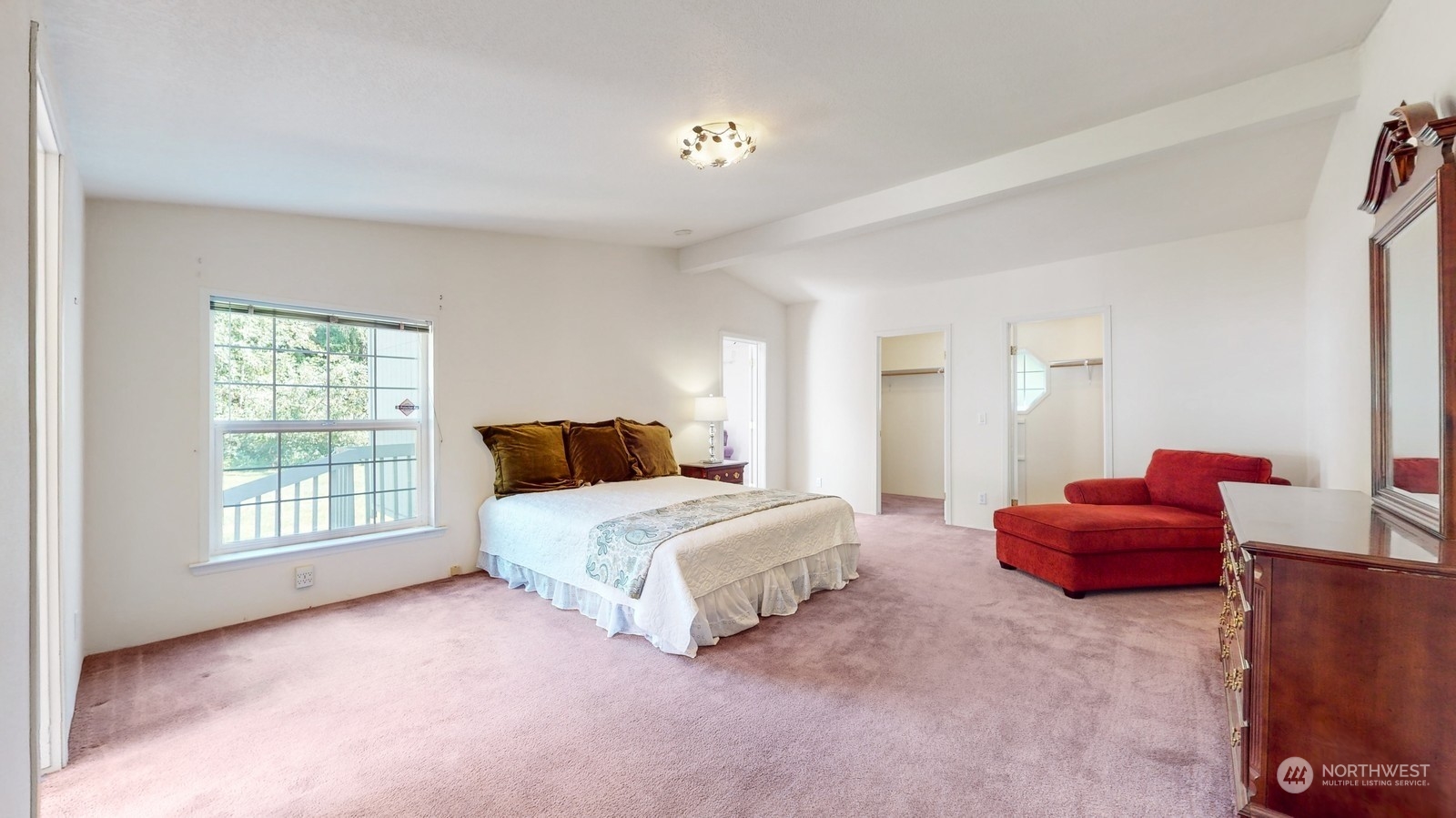 5507 189th Street Southeast Bothell, WA 98012 - Photo 25 of 37 a spacious bedroom with a bed and a couch