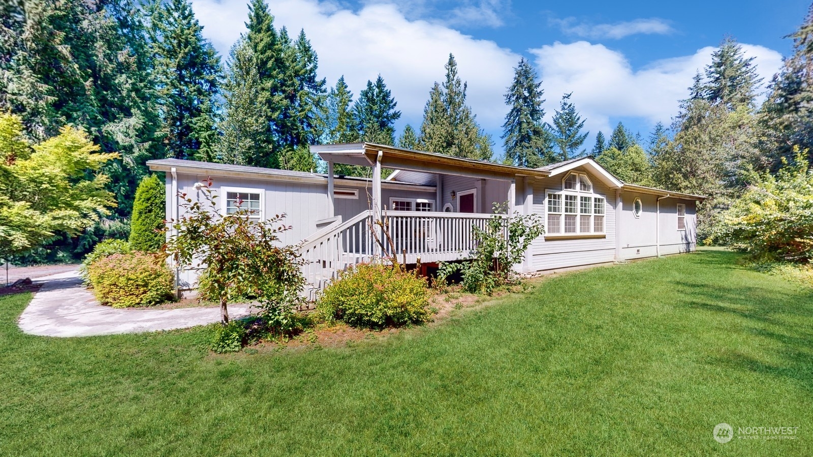 5507 189th Street Southeast Bothell, WA 98012 - Photo 3 of 37 a view of a house with a yard and sitting area