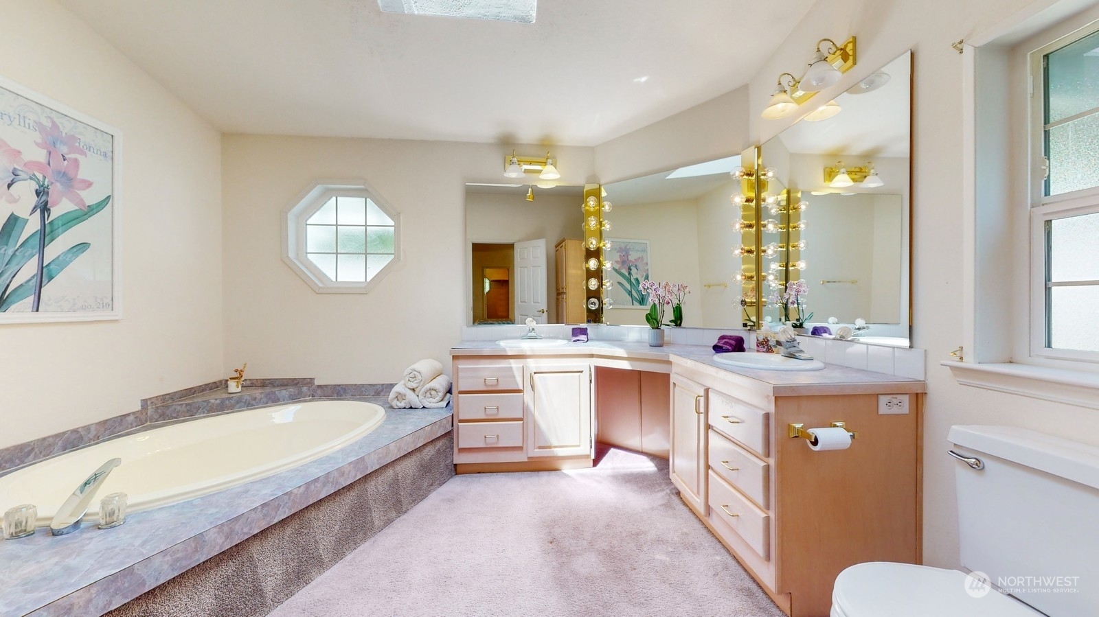 5507 189th Street Southeast Bothell, WA 98012 - Photo 32 of 37 a bathroom with a granite countertop tub sink and mirror