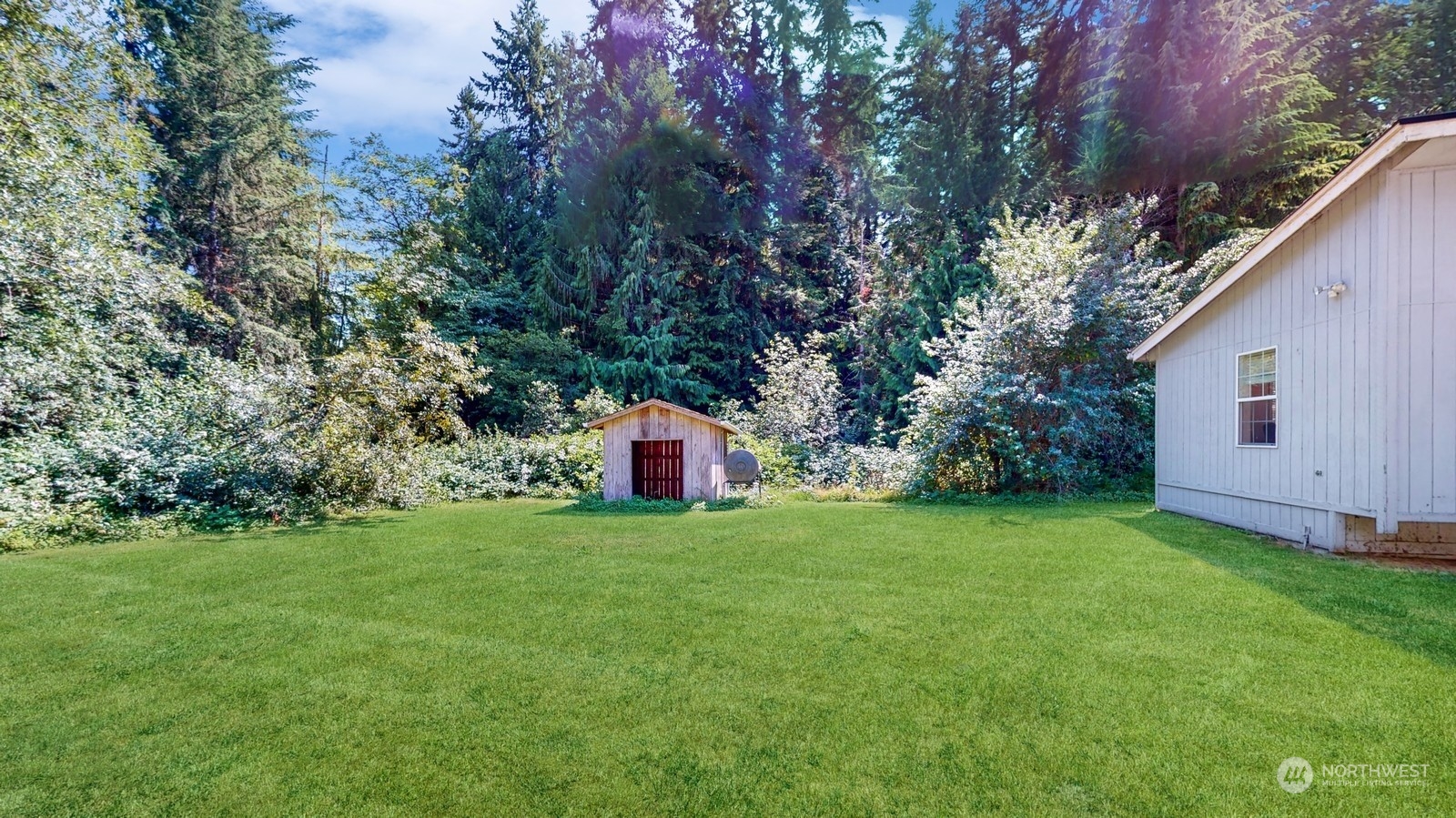 5507 189th Street Southeast Bothell, WA 98012 - Photo 34 of 37 a view of a house with backyard and garden