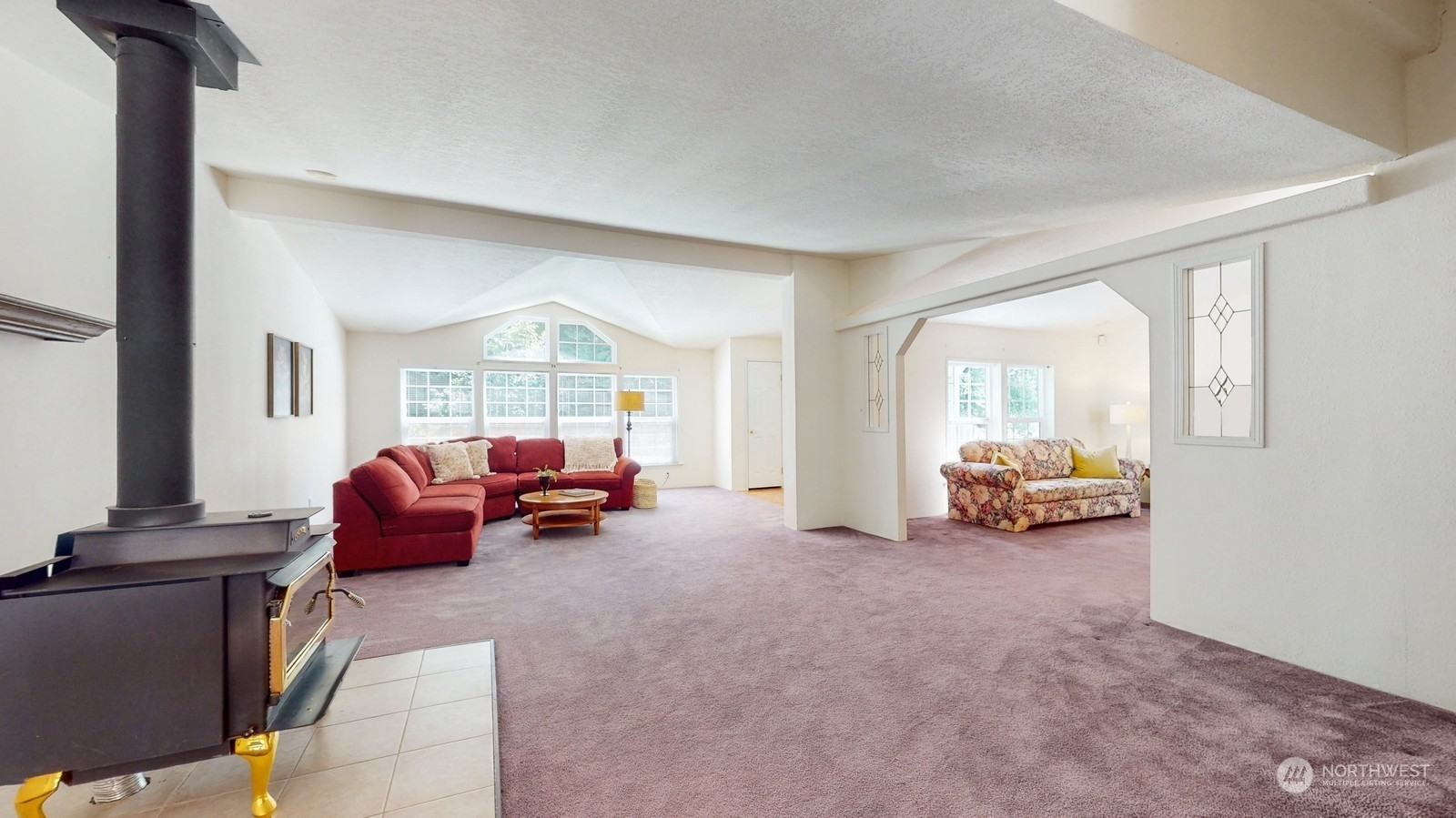 5507 189th Street Southeast Bothell, WA 98012 - Photo 6 of 37 a bedroom with furniture and a large window