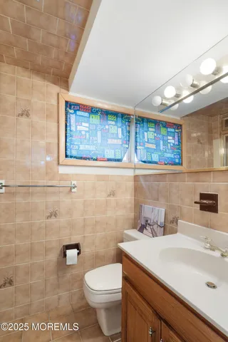 a bathroom with a glass door shower