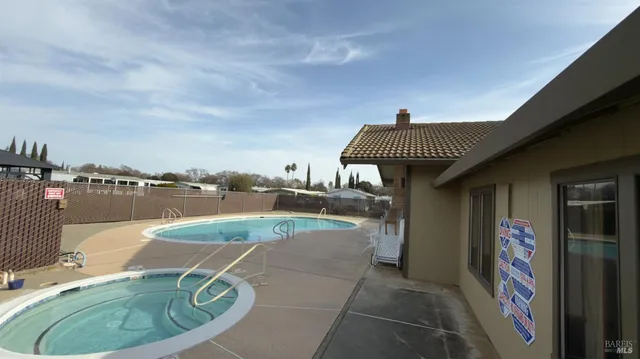 a view of a swimming pool with a terrace