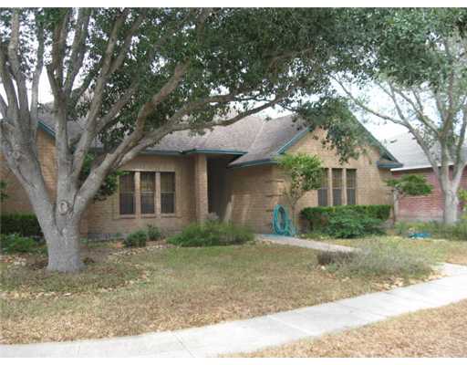 4506 Moonlake Ridge Drive Corpus Christi, TX 78413 - Photo 2 of 6 a front view of a house with a yard and shrubs