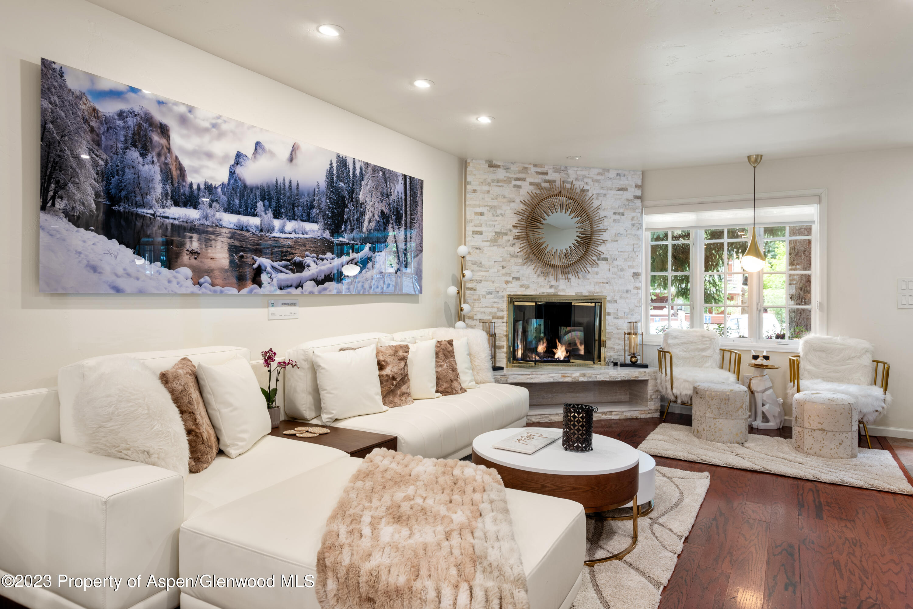 a living room with furniture and a fireplace