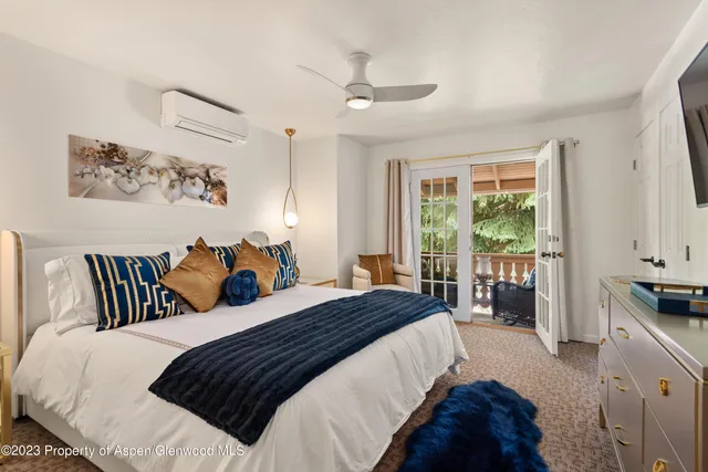 a bedroom with bed and a window