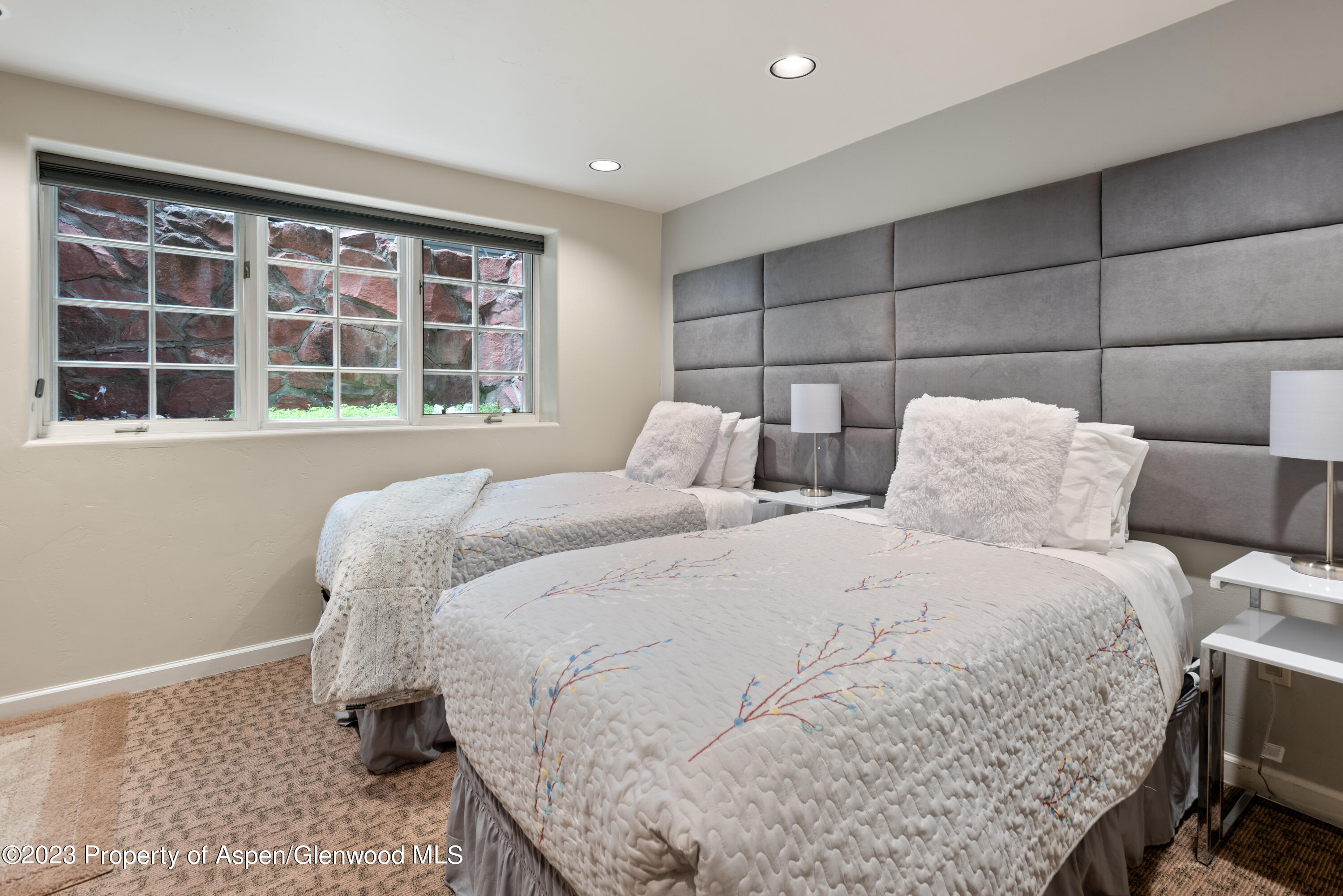 711 South Galena Street, Unit 20D Aspen, CO 81611 - Photo 17 of 26 a bedroom with a bed and a window