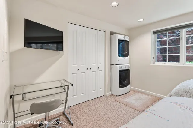 a bedroom with furniture and window