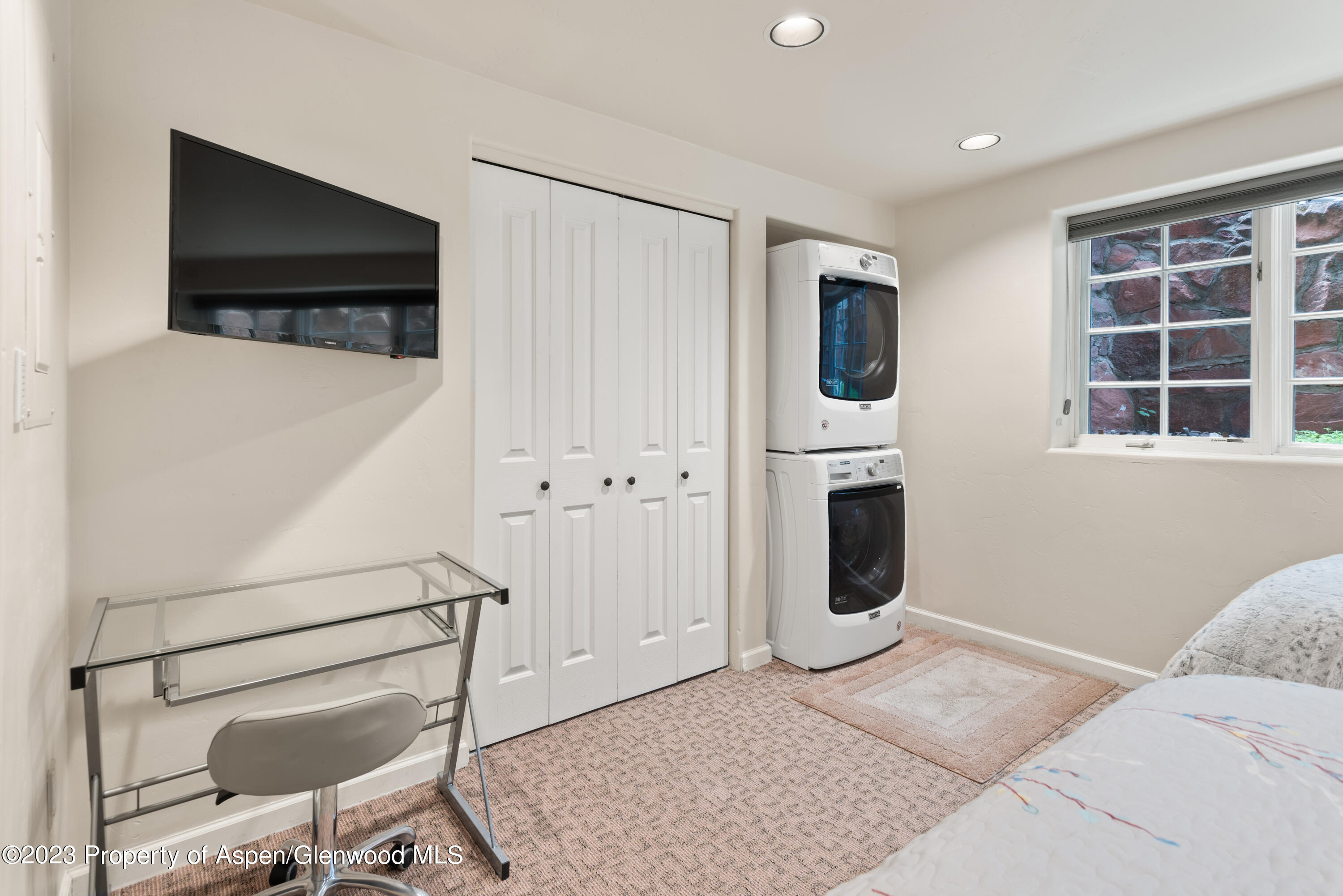 711 South Galena Street, Unit 20D Aspen, CO 81611 - Photo 18 of 26 a bedroom with furniture and window