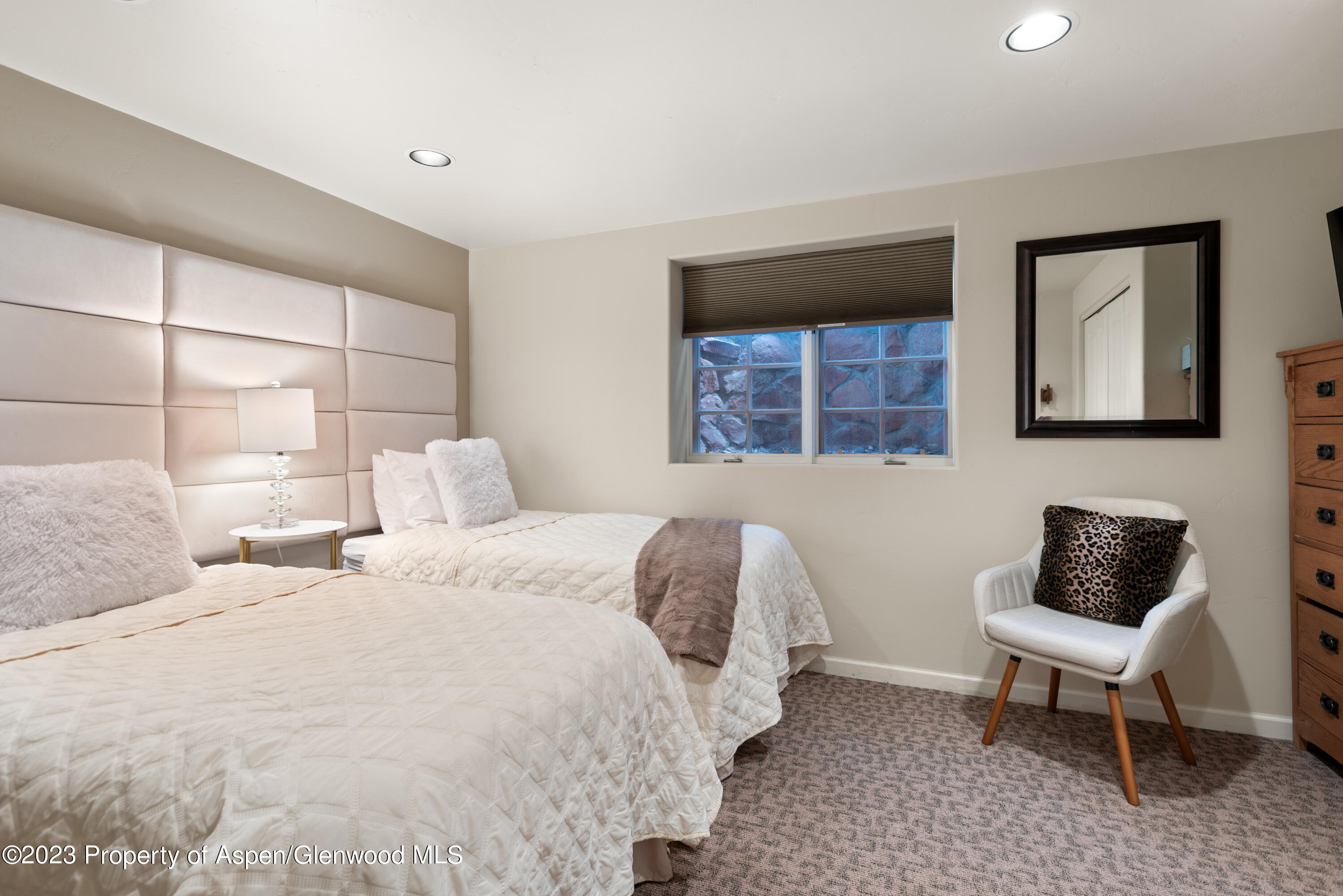 711 South Galena Street, Unit 20D Aspen, CO 81611 - Photo 19 of 26 a bedroom with a bed and a window