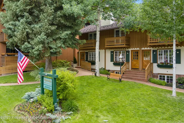 a view of an house with backyard porch and sitting area