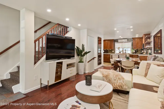 a living room with furniture and a flat screen tv