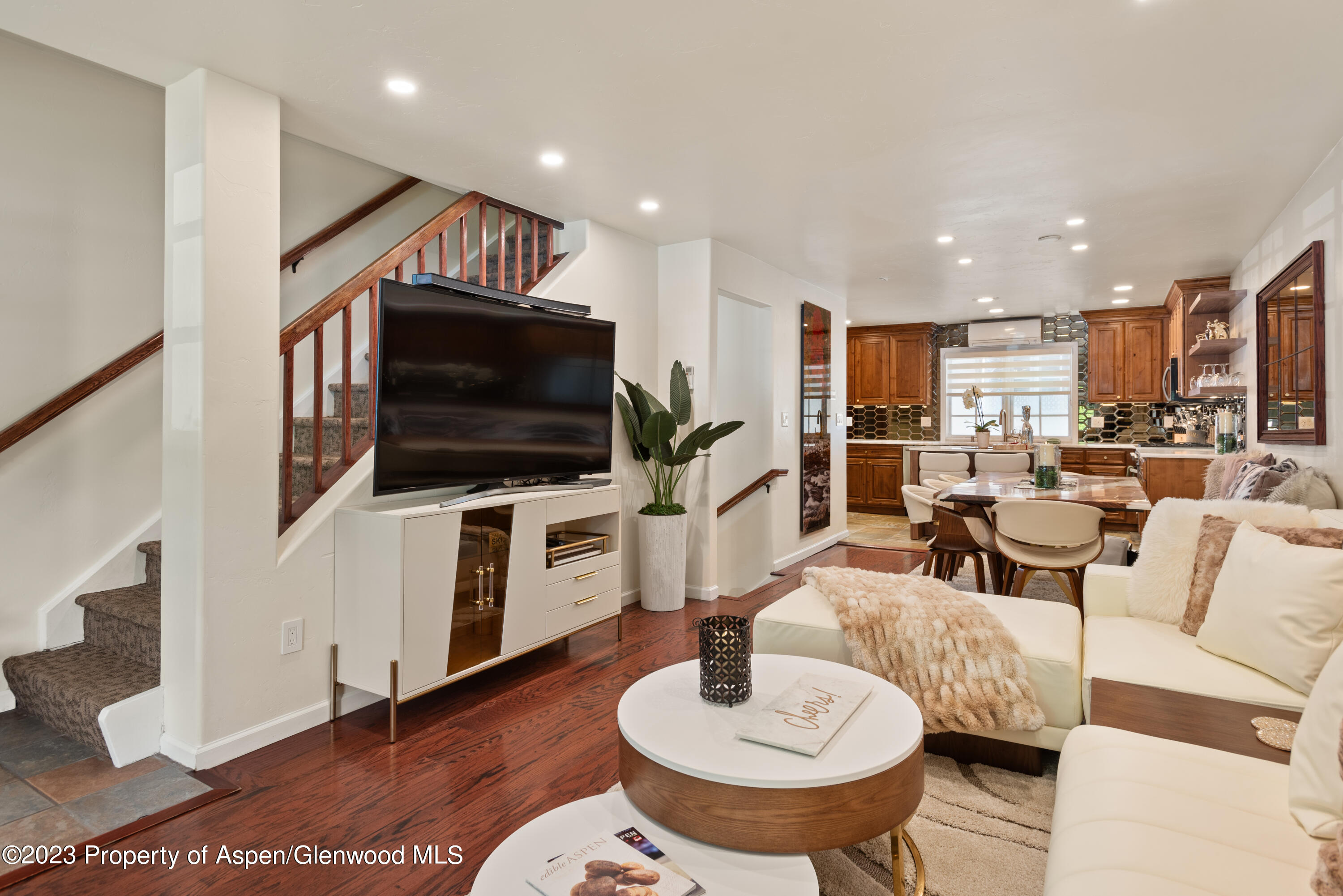 711 South Galena Street, Unit 20D Aspen, CO 81611 - Photo 4 of 26 a living room with furniture and a flat screen tv