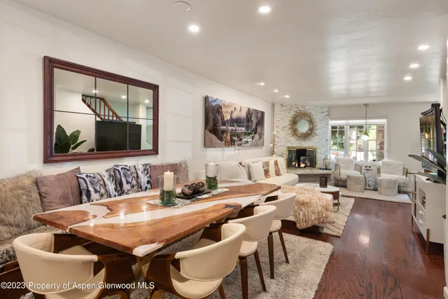 a view of a dining room with furniture and wooden floor