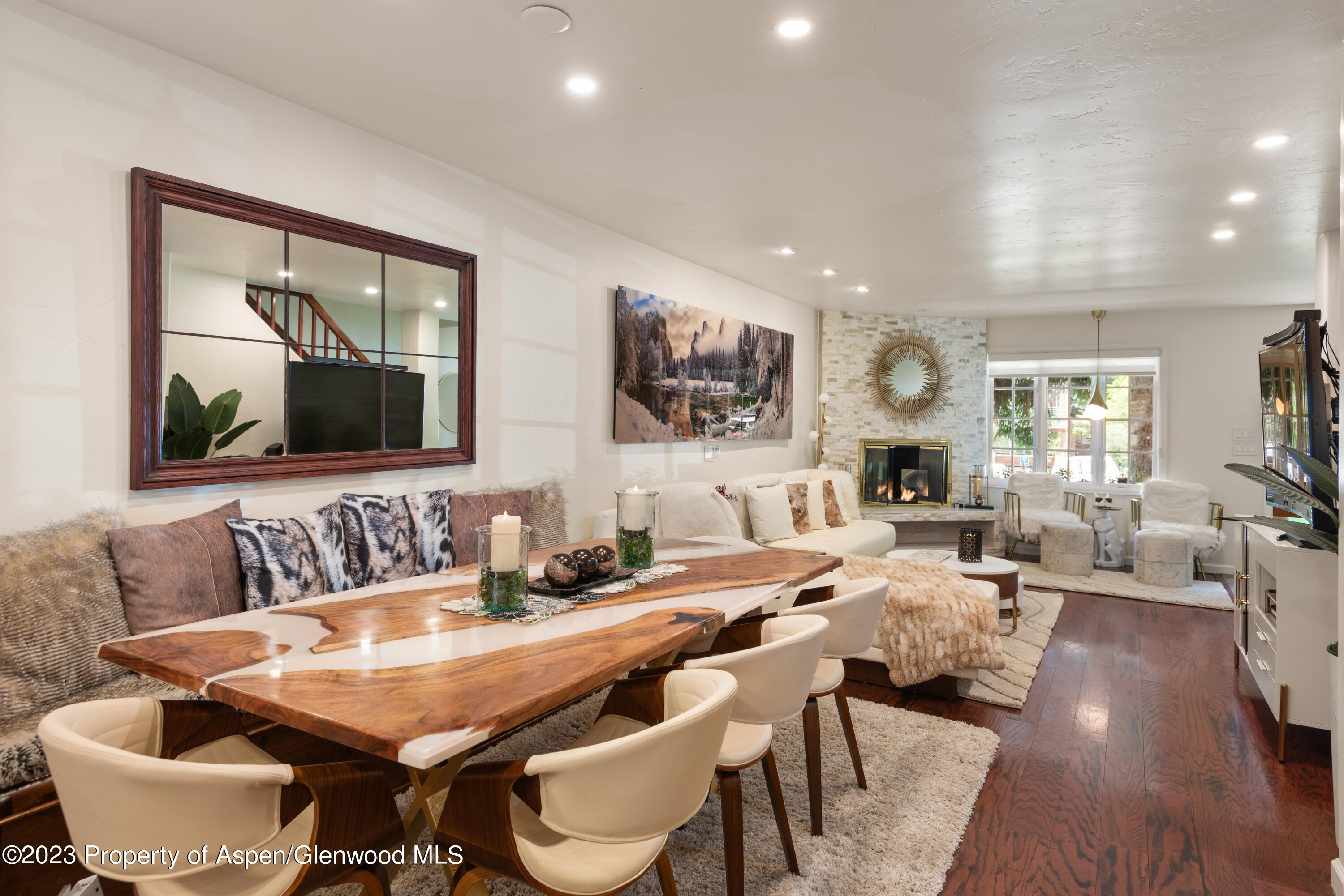 711 South Galena Street, Unit 20D Aspen, CO 81611 - Photo 5 of 26 a view of a dining room with furniture and wooden floor