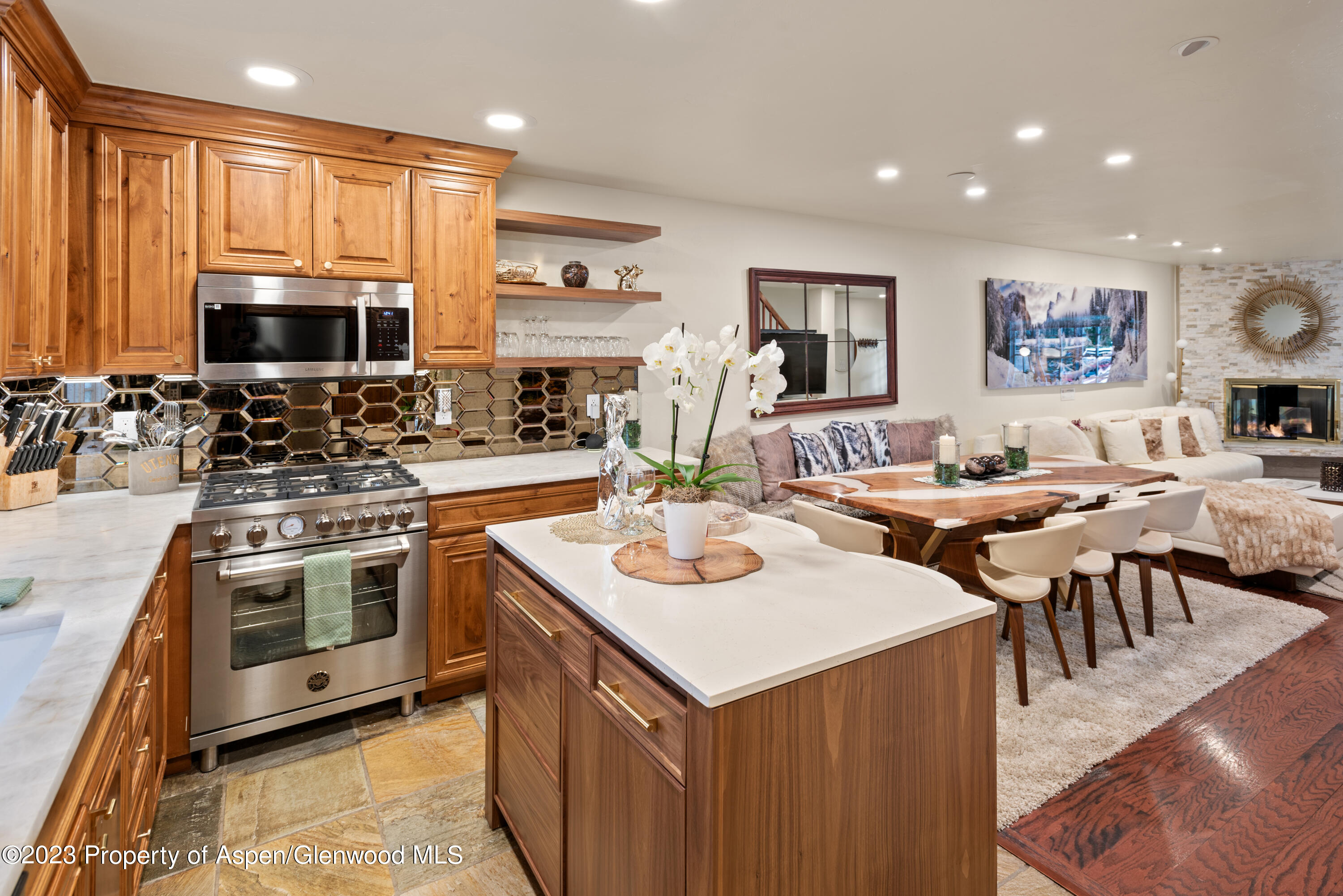 711 South Galena Street, Unit 20D Aspen, CO 81611 - Photo 8 of 26 a kitchen with lots of counter top space a sink appliances and cabinets