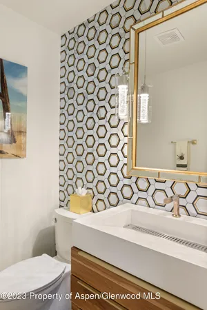 a bathroom with a sink and a toilet
