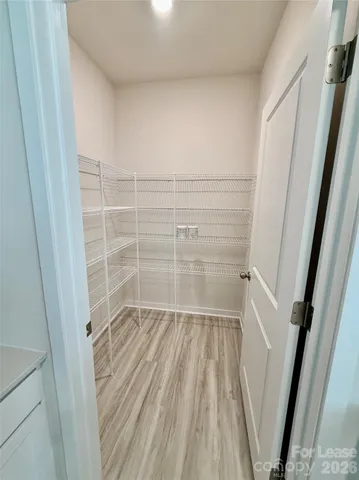 a view of wooden floor in a bathroom