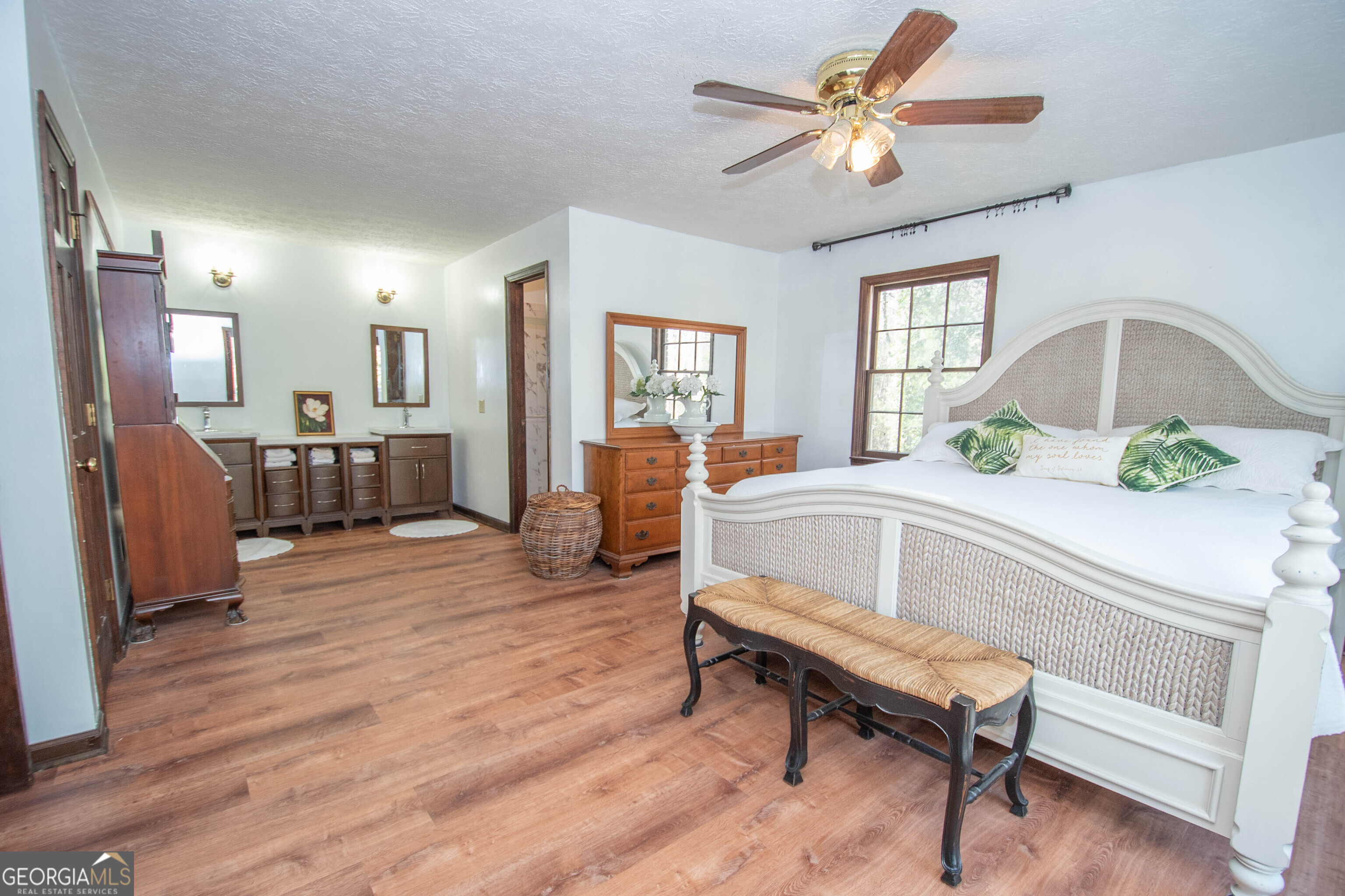 151 Evans Road Milner, GA 30257 - Photo 14 of 53 a living room with furniture and a wooden floor
