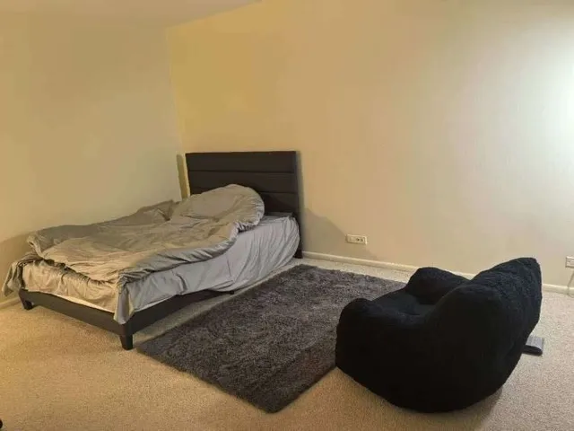 a living room with a bed and a couch