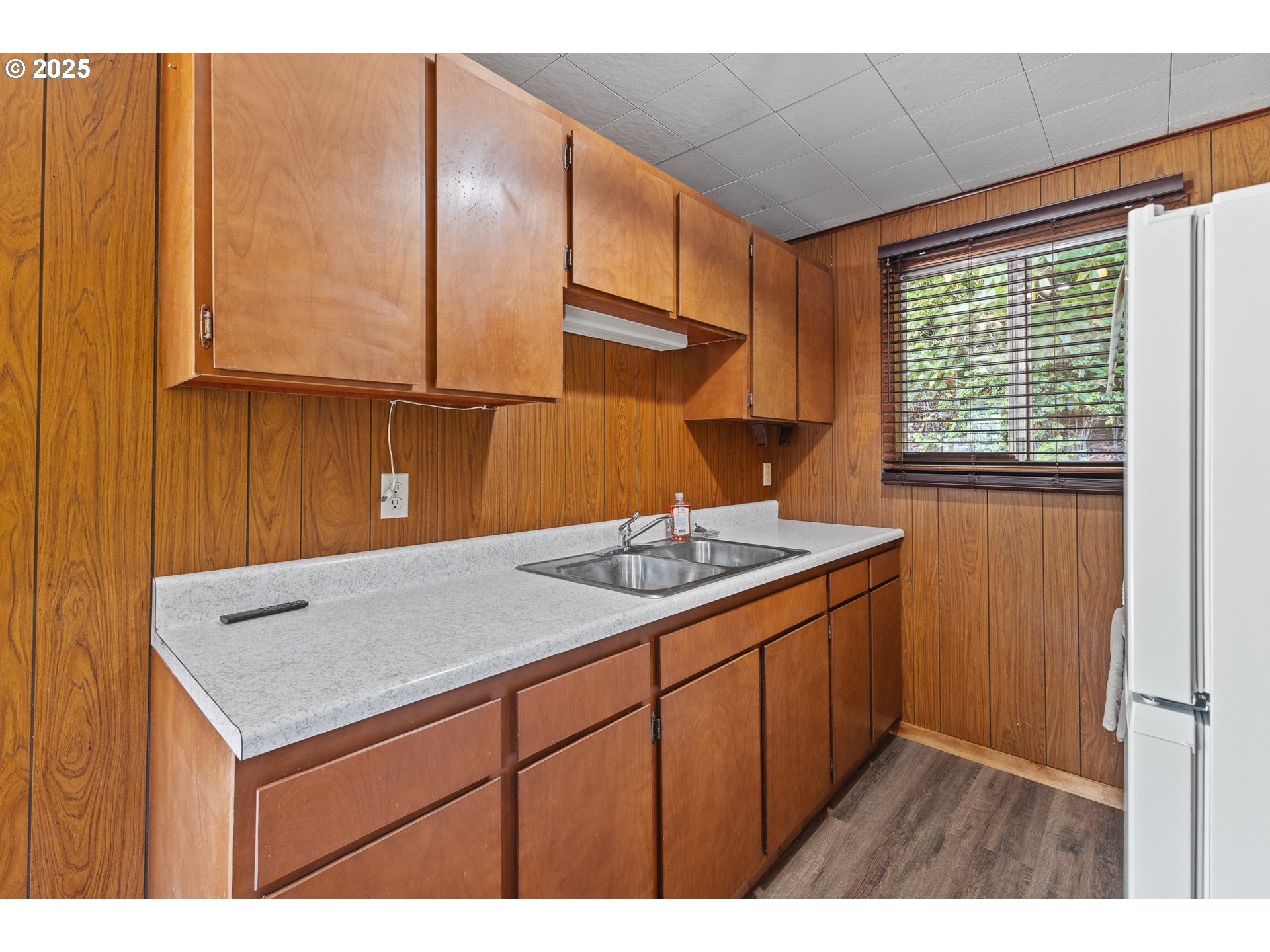 1523 North Tenmile Lakeside, OR 97449 - Photo 8 of 26 a kitchen with a sink cabinets and window