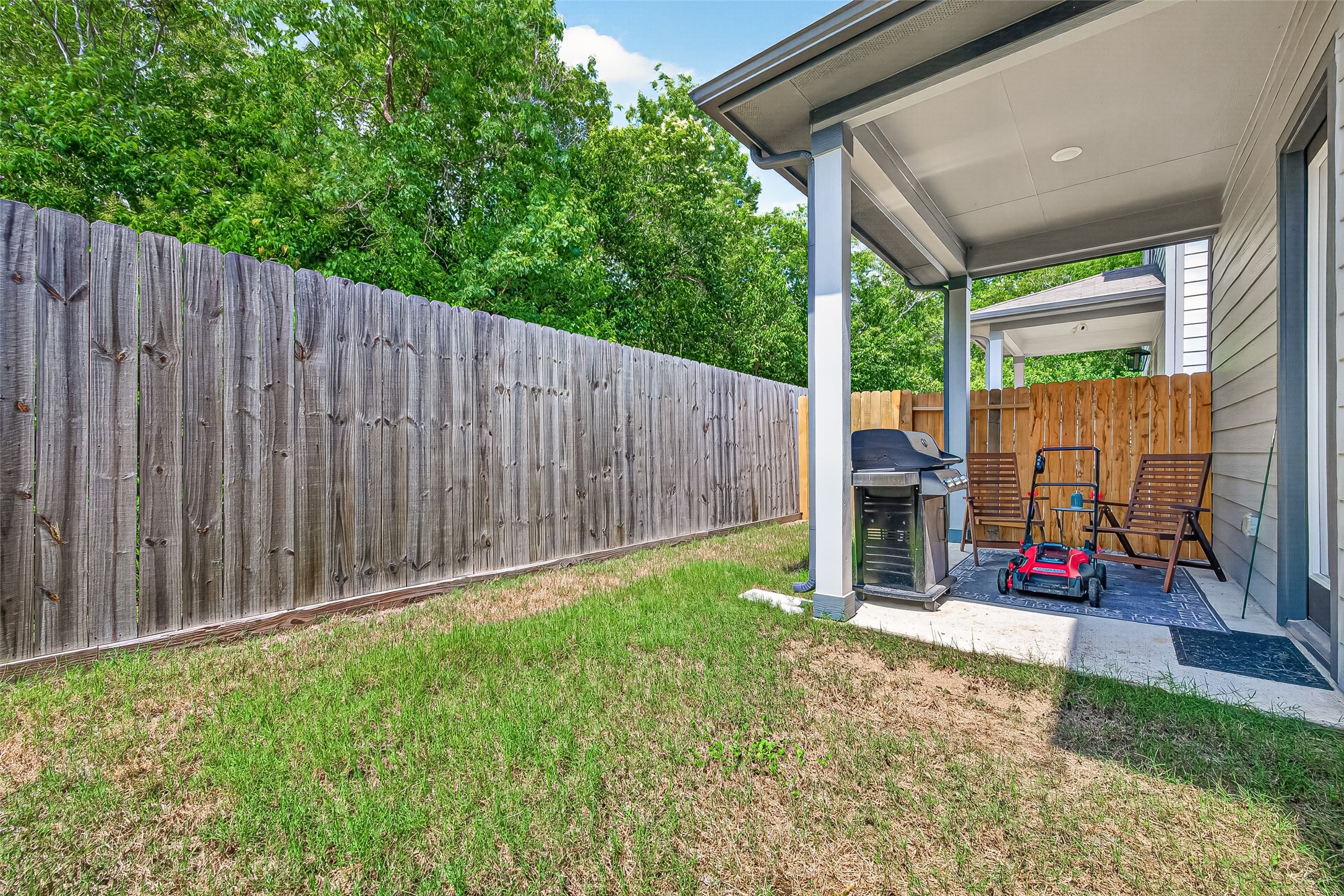 4004 Baja Lane Houston, TX 77045 - Photo 34 of 34 Your own private outdoor retreat! This wonderful backyard layout perfectly pairs a shaded covered patio with a lovely green lawn area.