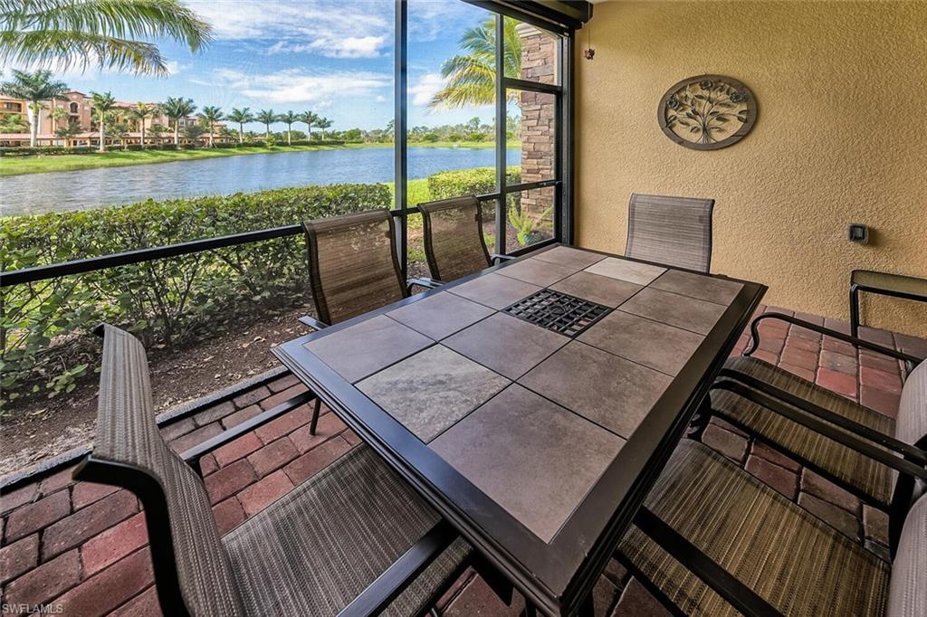 9528 Avellino Way, Unit 2515 Naples, FL 34113 - Photo 22 of 35 a view of a balcony with lake view and wooden floor