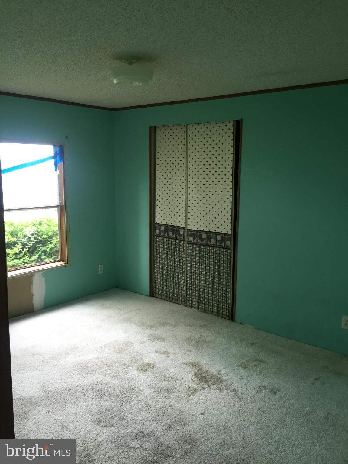 4970 Harmony Road Preston, MD 21655 - Photo 14 of 18 a view of an empty room with a window