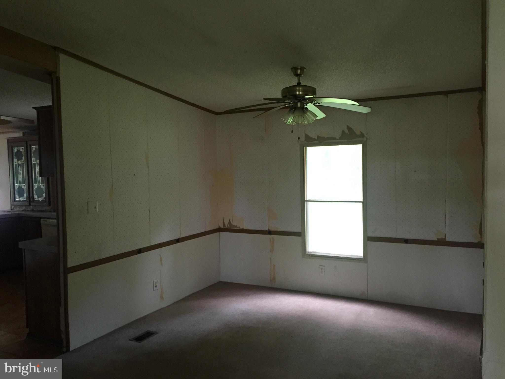 4970 Harmony Road Preston, MD 21655 - Photo 8 of 18 a view of an empty room with a window