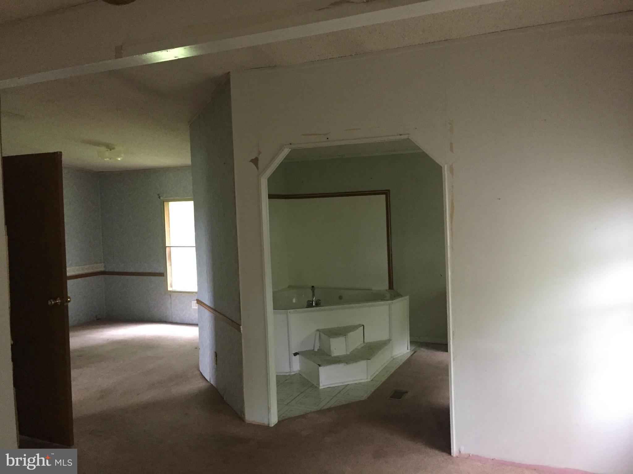 4970 Harmony Road Preston, MD 21655 - Photo 10 of 18 a bathroom with a toilet