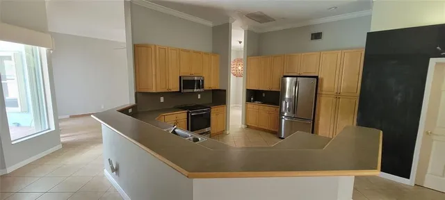 a kitchen with a refrigerator and a sink