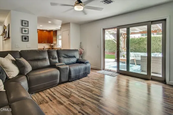 a view of a livingroom with furniture and wooden floor