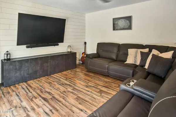 a living room with a couch and a flat screen tv