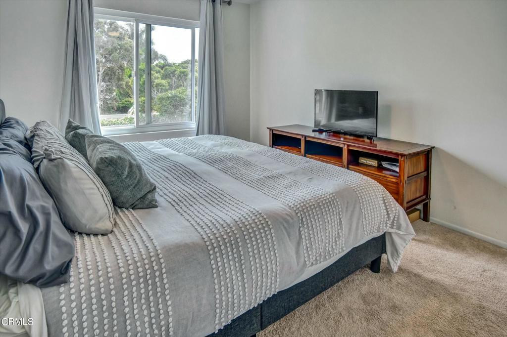 508 Village Road Port Hueneme, CA 93041 - Photo 22 of 38 a bedroom with a bed and a flat screen tv